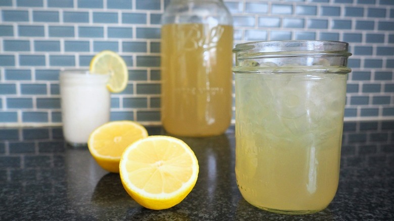 jars of lemonade with sliced lemons