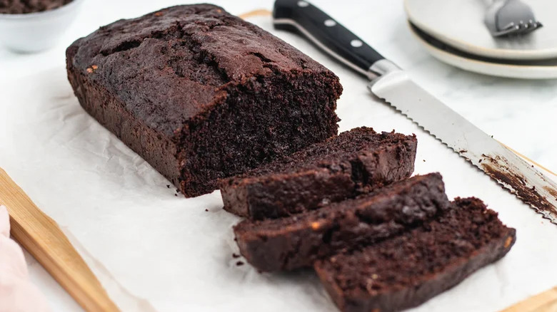 sliced chocolate zucchini cake with knife