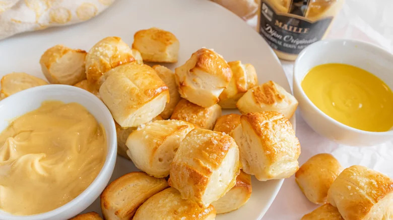 plate of soft pretzel bites with dijon mustard dipping sauce