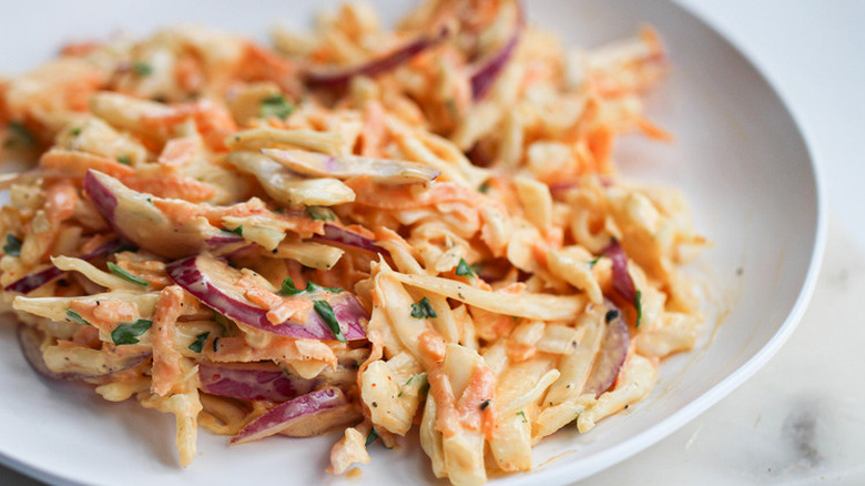 Shallow dish of spiced cole slaw salad. 