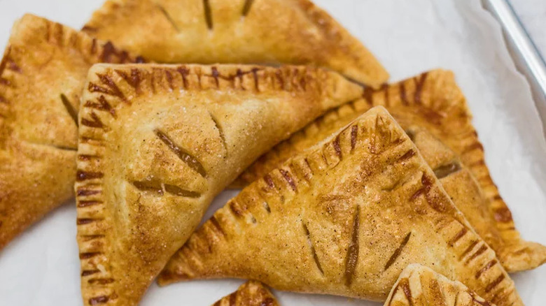 Triangular pocket pies with apple filling. 