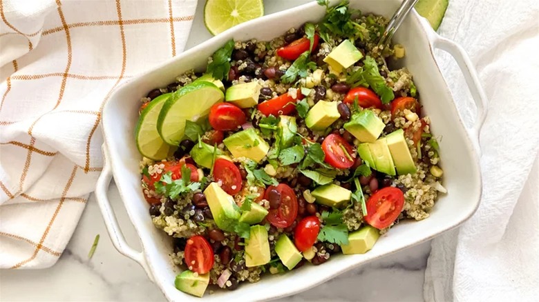 Mexican quinoa salad in white casserole dish