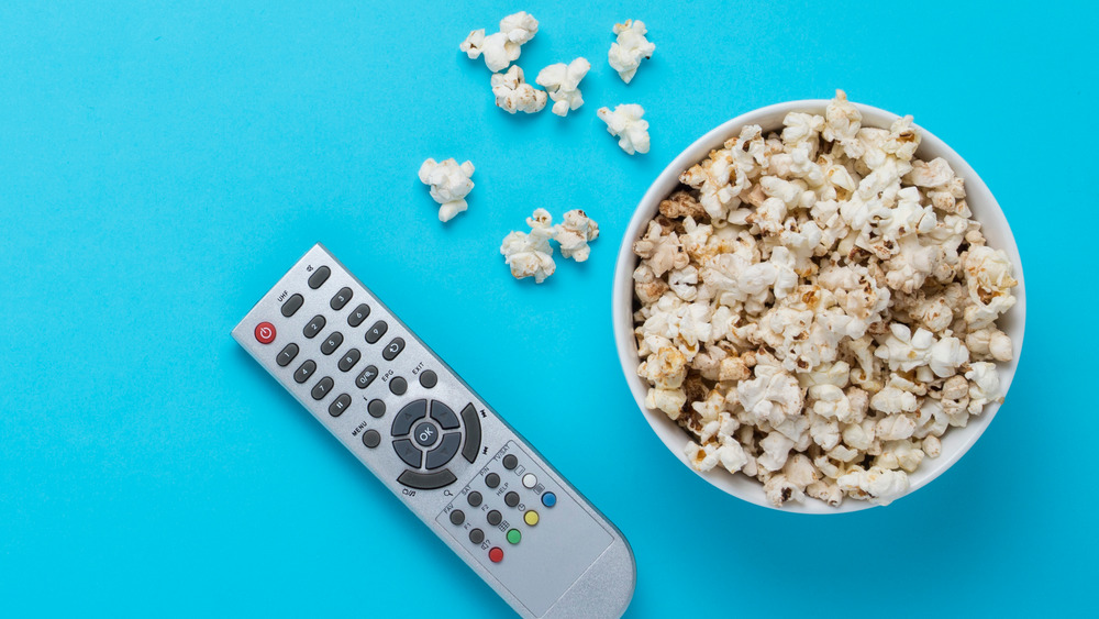 Popcorn next to TV remote