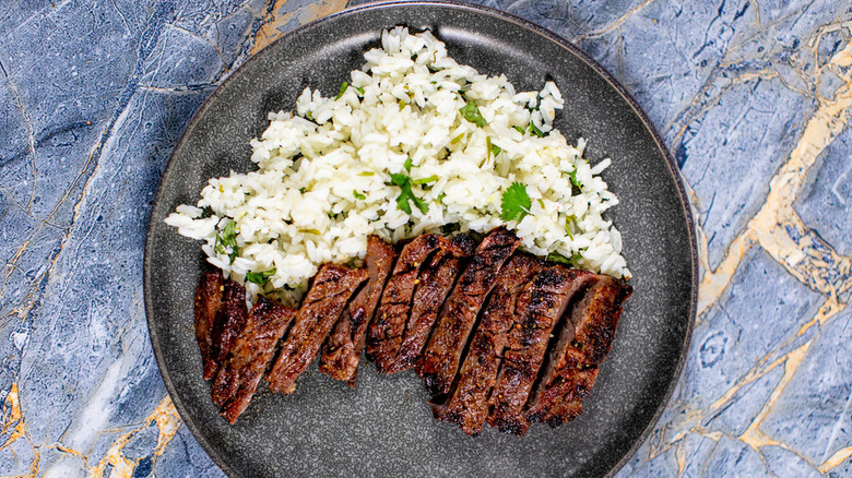 sliced steak with rice