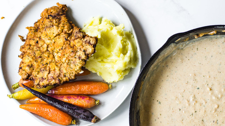 breaded steak with whole carrots