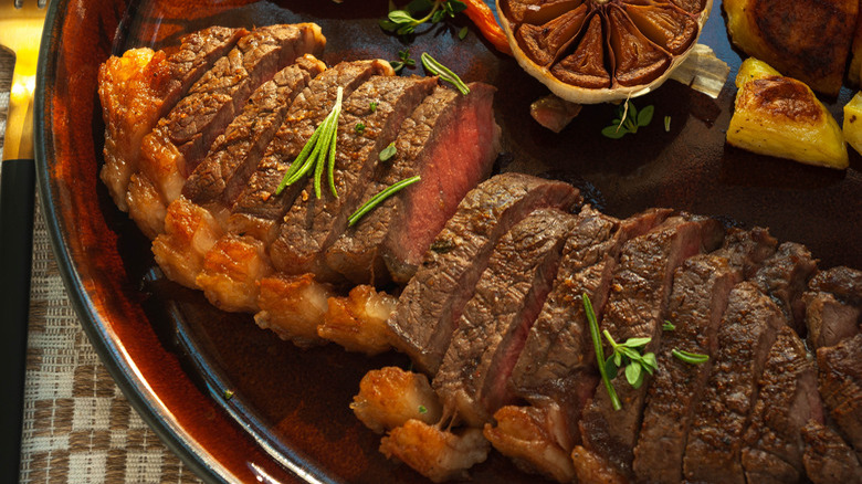 sliced steak on plate