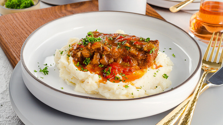 swiss steak on mashed potatoes