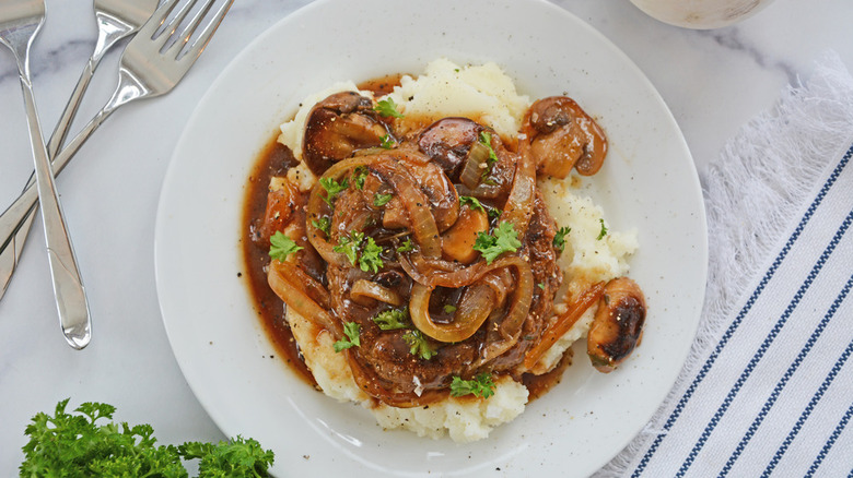 salisbury steak on mashed potatoes