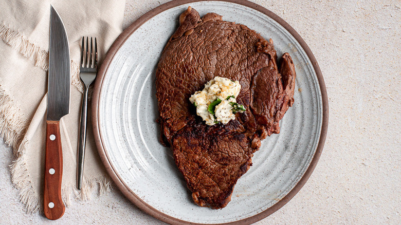 steak with butter on plate 