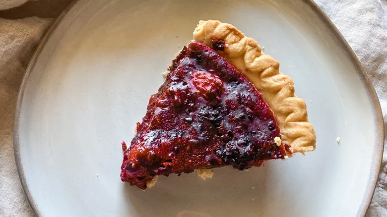 slice of blackberry pie on plate