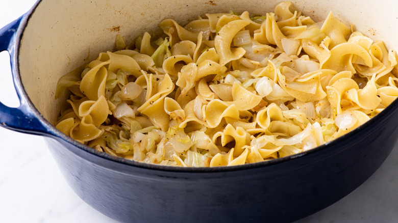 cabbage and noodles in pan