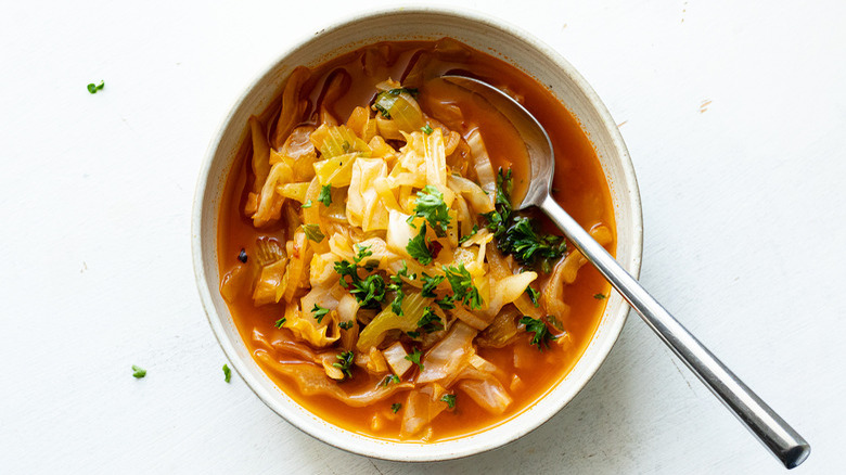 cabbage soup in white bowl