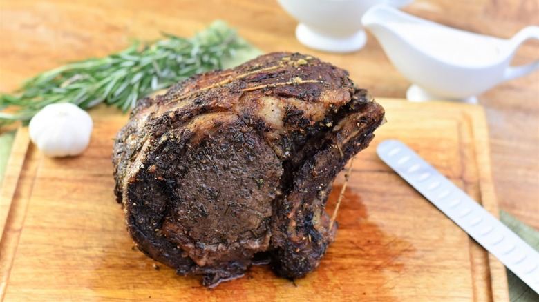 Prime Rib and garlic and rosemary and knife