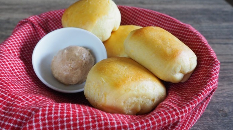 butter and rolls in basket