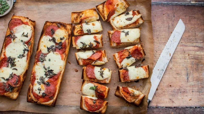 sliced pizza bread with knife