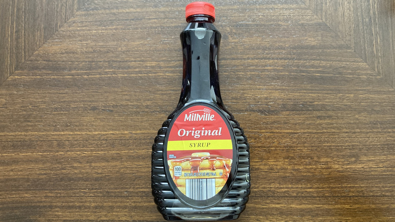 A bottle of Millville Original Pancake Syrup is shown.