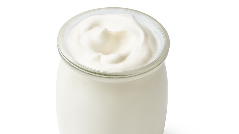 Yogurt in a plain glass jar 