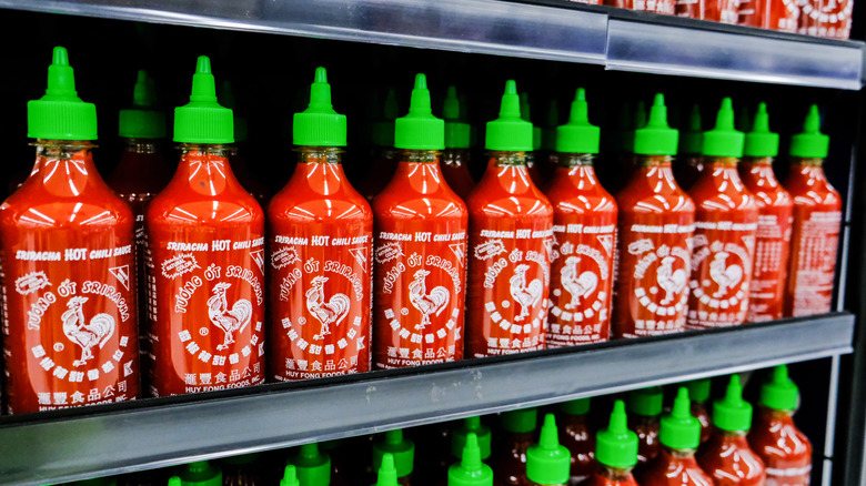 Bottles of Sriracha on a shelf