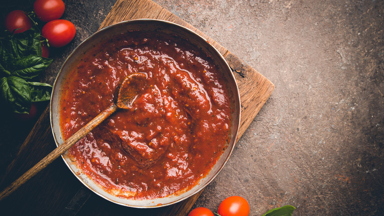 A grey bowl of tomato paste