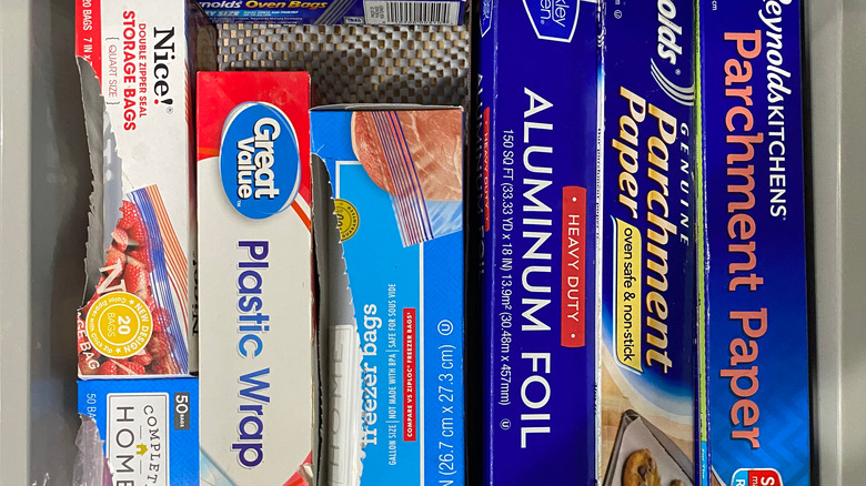 Variety of brands of packaging materials including parchment paper, aluminum foil, and plastic wrap