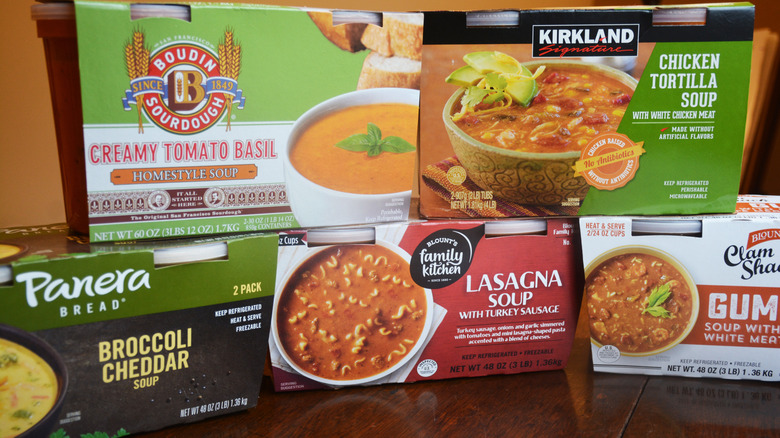 Five boxes of Costco soups are displayed on a table.