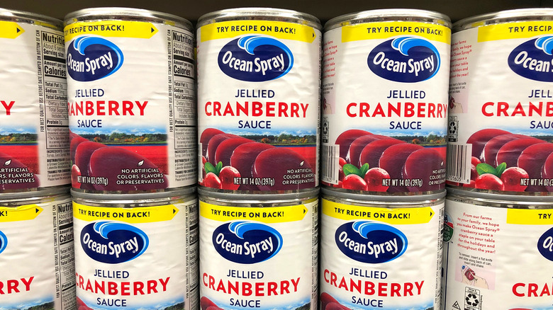 Cans of Ocean Spray cranberry sauce on store shelves