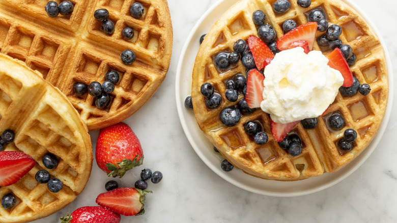 Waffles with whipped cream and berries