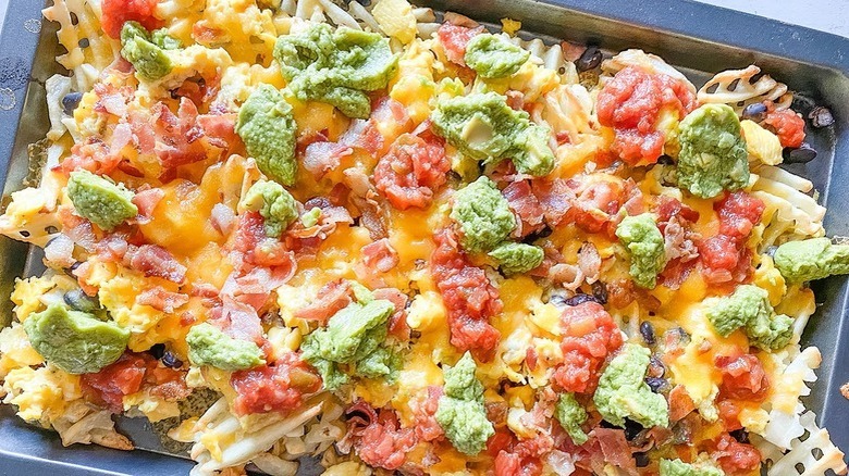 Nachos with eggs on waffle fries