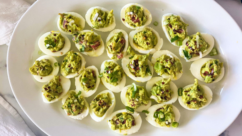 Deviled eggs with guacamole filling