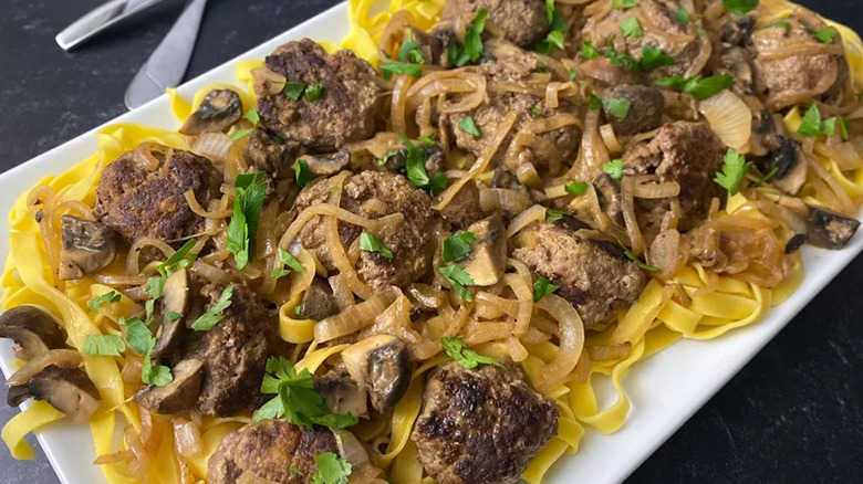 Ground beef patties, mushrooms, onions, and egg noodles.