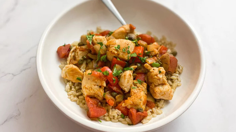 Bowl with rice, diced chicken, and peppers.