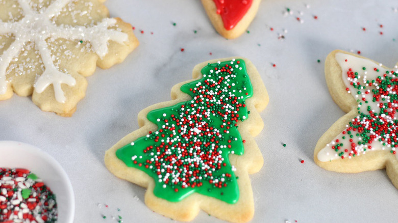 Decorated tree-shaped cookie with sprinkles