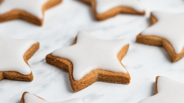 Star shaped spice cookies with white icing