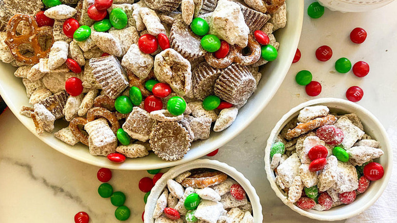 Cereal snack mix with red and green M&Ms.