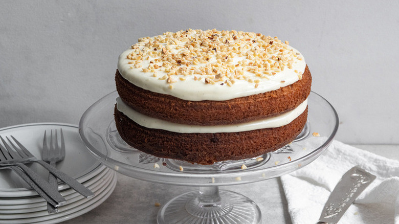 2-layer spice cake with white frosting and nuts