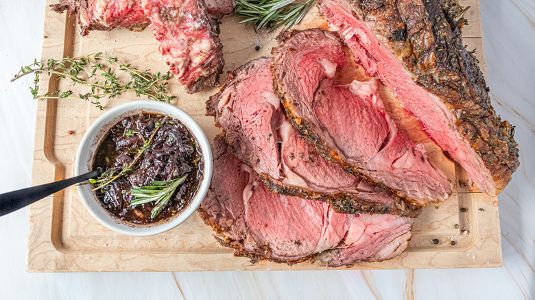 Prime rib on wooden cutting board