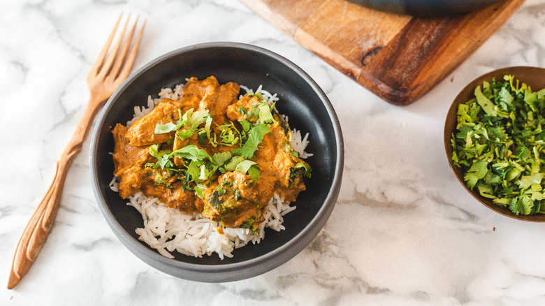 Bowl of chicken, rice, and cilantro