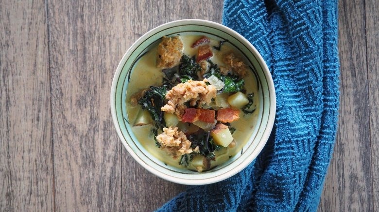 Bowl of soup with sausage and spinach