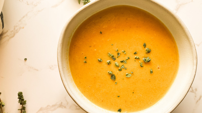 Squash soup in white bowl