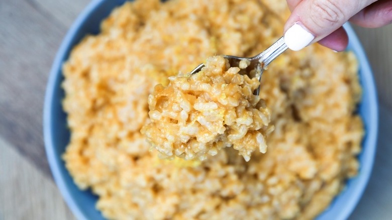 Risotto in blue bowl with spoon