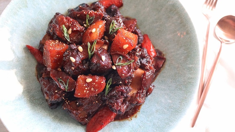 Plate of oxtail with vegetables