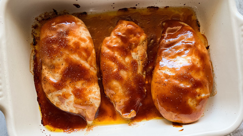 Cooked chicken breasts with barbecue sauce 