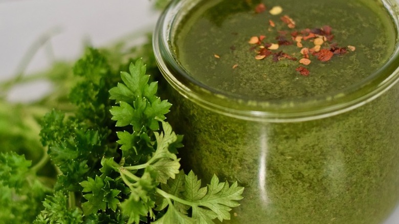 Jar of green herb sauce