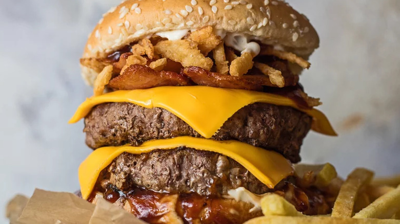Tall double cheeseburger with fried onions