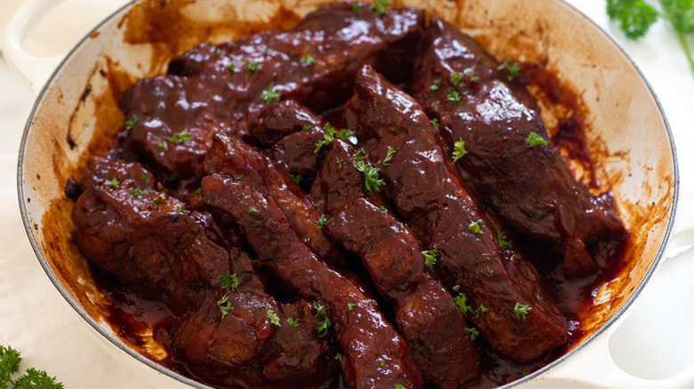 Cooked barbecue ribs in a large pot