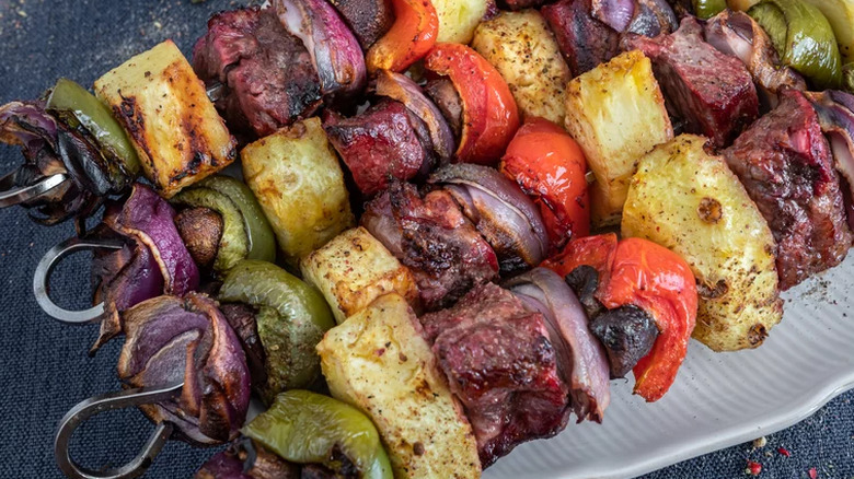 Skewers of grilled steak and vegetables