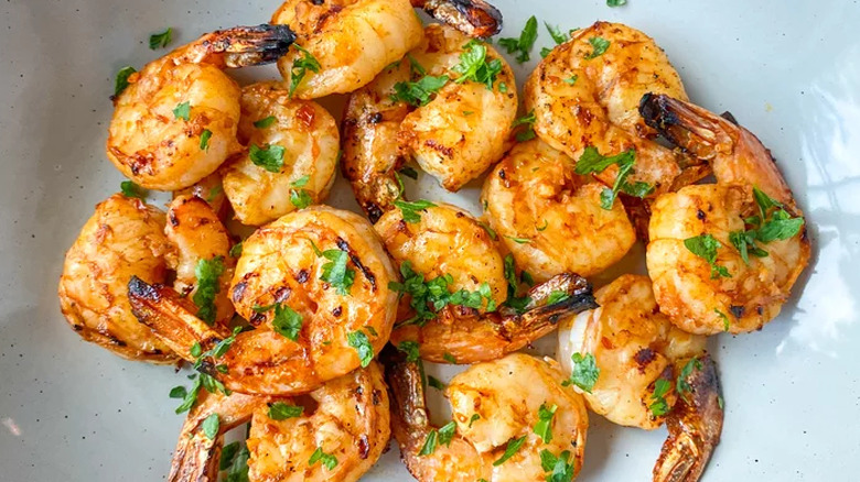 grilled and seasoned shrimp in a bowl