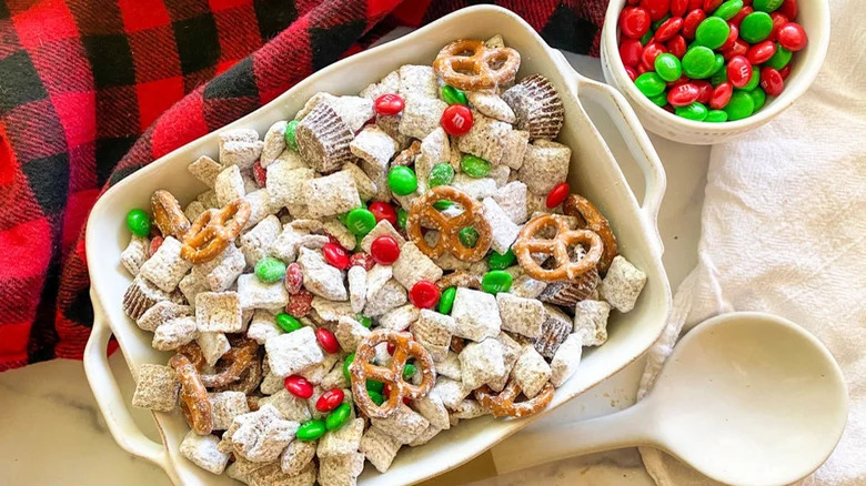 A tray of puppy chow with pretzels and M&Ms 