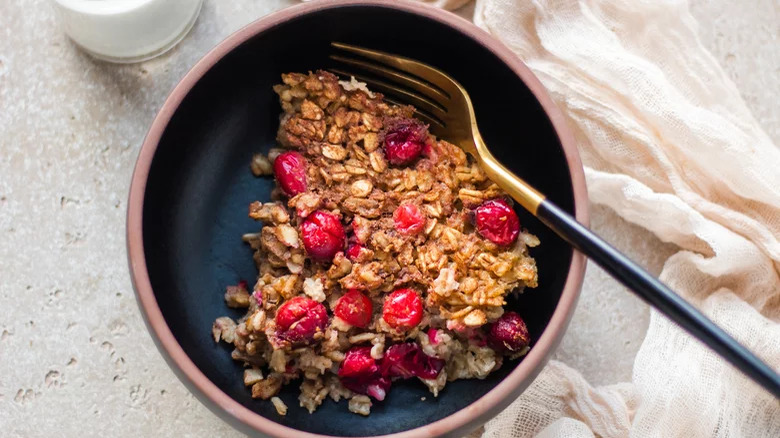 Cranberry oatmeal in a bowl with a fork