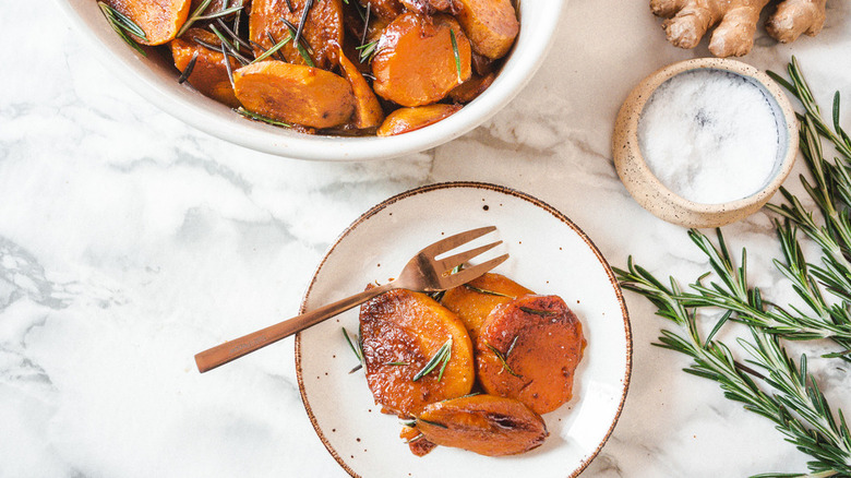 Candied yams in a plate with a fork